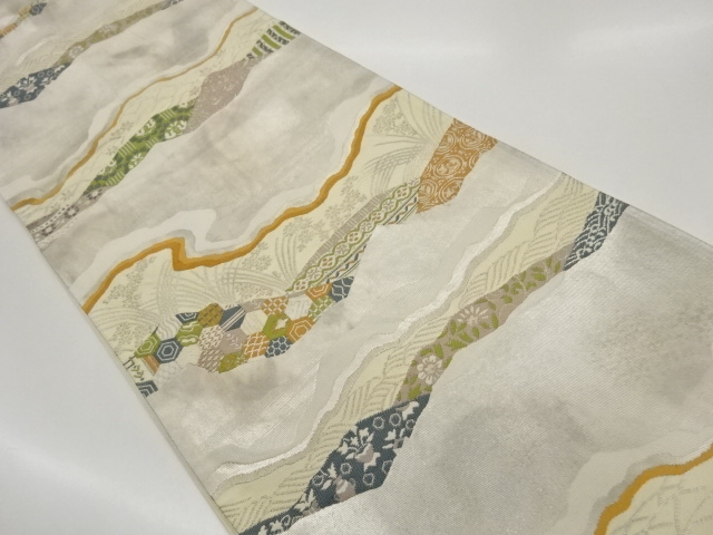 道長取りに草花・亀甲模様織出し袋帯